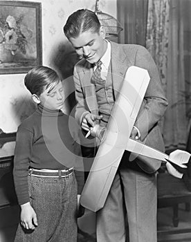 Brothers with model airplane photo