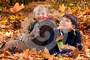 Brothers playing in Autumn