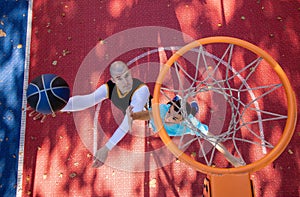 Brothers playing basketball One On One.