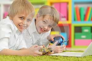 Brothers playing a computer game