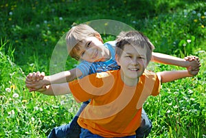 Brothers playing in meadow