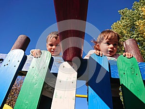 Brothers playing at the playground