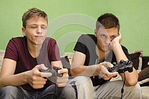 Brothers playing video games boredom