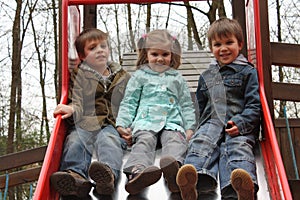 Brothers and sister at the playground