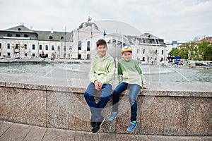 Brothers sit on fountain at Grassalkovich Palace, Bratislava, Europe. Residence of the president of Slovakia in Bratislava