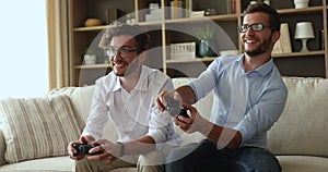 Brothers twins play video games, give high five celebrate victory