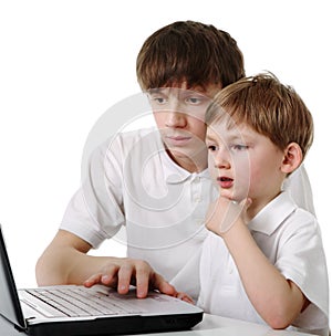 Brothers using laptop