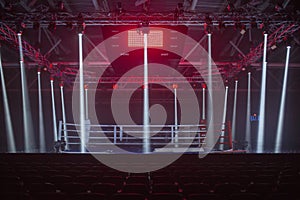 Brovary, Ukraine, 14.11.2015 boxing ring in low-light spotlights and red illumination from above