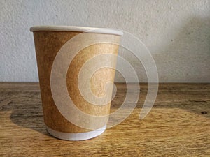 Browe cup hot coffee on the table.