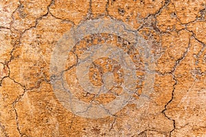 Brown adobe clay wall texture background. Material construction.