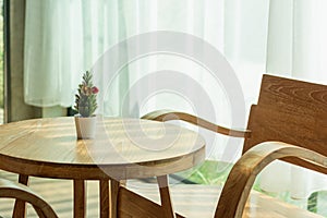 Brown antique teak table set in the interior of coffee shop