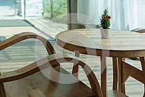 Brown antique teak table set in the interior of coffee shop