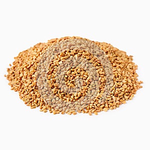 Brown aromatic fenugreek seeds isolated on white background