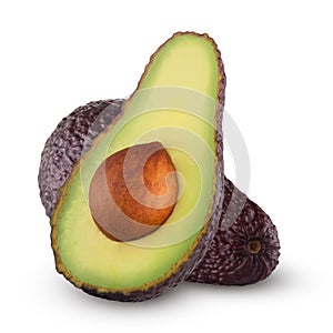 Brown avocado with avocado leaves on a white background.