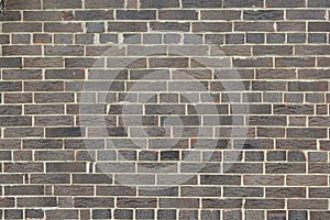 Brown background of unusual building brick