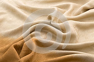 Brown background luxury cloth or wavy folds of grunge silk texture satin velvet