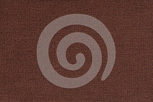 Brown background from a textile material with wicker pattern, closeup.