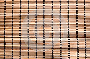 Brown background with thin strips of bamboo tree