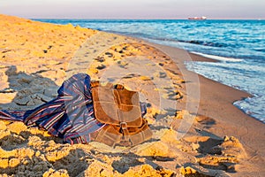 Brown backpack of traveler on seashore. . Baltic Sea, Hel, Pomerania, Poland.