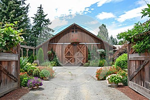 Brown barn on farm landscape