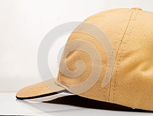 Brown baseball hat on a white background