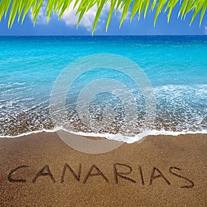 Brown beach sand with written word Canarias photo