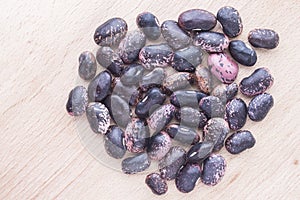 Brown beans on wooden background