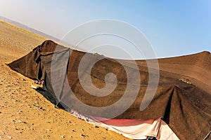 Brown Bedouin tent in the desert