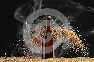 Brown beer bottle with reflections on a  smoke black  background with heavily scattering wheat grains