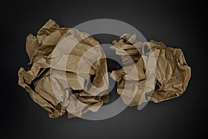 Brown and beige crumpled paper ball.