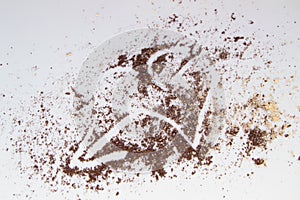 Brown and beige eye shadow scattered on white background, texture for make-up painted with a heart pierced by an arrow