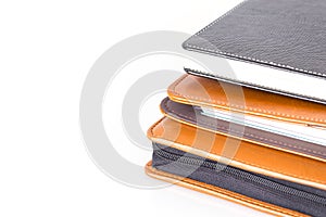 Brown and black leather diary books.