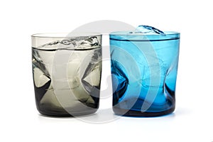 A brown and blue colour glass fill with fresh ice and water