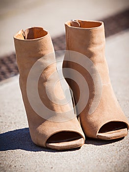 Brown boots with high heels and peep toes