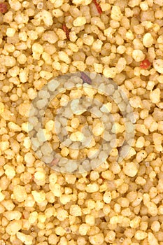 Brown bowl with couscous on white background