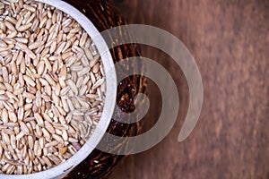 In a brown bowl of oatmeal close-up.