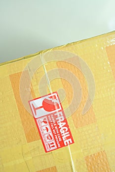 brown box packaging with warning symbol