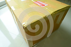 brown box packaging with warning symbol