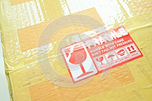 brown box packaging with warning symbol