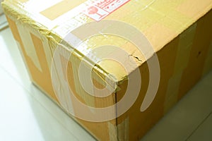 brown box packaging with warning symbol