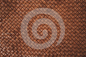 Brown braided leather background.