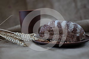 Brown bread on burlap background