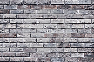 Brown brick wall texture. Gray grunge brickwork. Decorative tile surface. Bricks backgrounds. Messy wall pattern for wallpaper