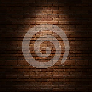 Brown brick wall with uniform, rectangular bricks in a staggered pattern. The surface