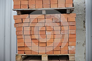 Brown bricks batch on wooden storage tray
