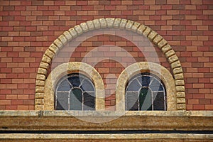 Brown bricks with stained glass window arch design