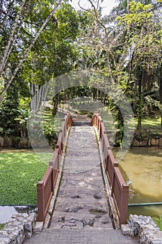 Brown Bridge over the lake river Tasik Perdana Botanical Gardens