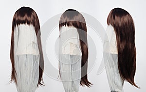 Brown brunette long straight hair wig on mannequin head over white background , set of three