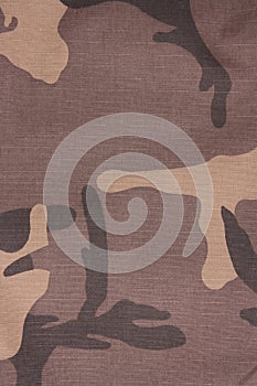 Brown camouflage seamless fabric background