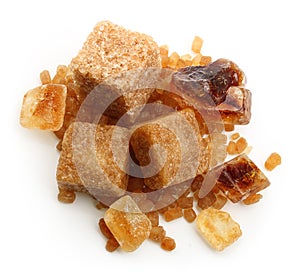 Brown cane sugar cubes and caramelized sugar